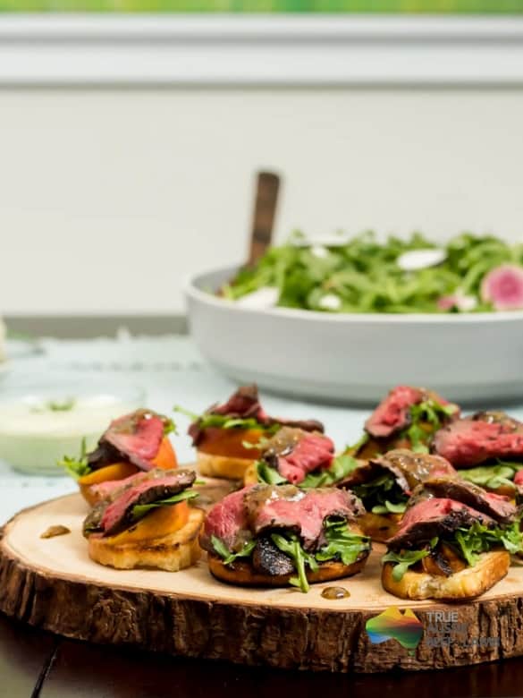 Mustard glazed beef tenderloin with peach and argula bruschetta Image